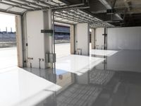 the industrial warehouse with flooring and ceilings has been completed and polished concrete is visible