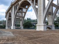 an overpass under a bridge in the middle of construction progress next to a construction site