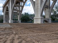 an overpass under a bridge in the middle of construction progress next to a construction site