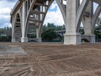 an overpass under a bridge in the middle of construction progress next to a construction site