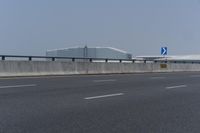 there is an airport and some other buildings in the background there are no traffic lights on it
