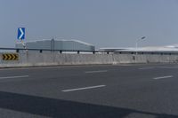 there is an airport and some other buildings in the background there are no traffic lights on it