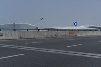 there is an airport and some other buildings in the background there are no traffic lights on it