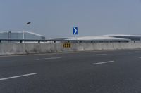 there is an airport and some other buildings in the background there are no traffic lights on it