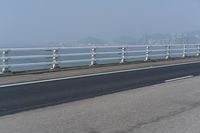 Concrete Bridge Overlooking the Coastal Waters of Hong Kong on a Clear Sky Day