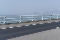 Concrete Bridge Overlooking the Coastal Waters of Hong Kong on a Clear Sky Day