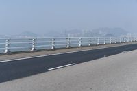 Concrete Bridge Overlooking the Coastal Waters of Hong Kong on a Clear Sky Day