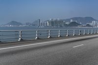 Concrete Bridge Overlooking the Coastal Waters of Hong Kong on a Clear Sky Day