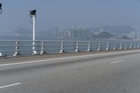 Concrete Bridge Overlooking the Coastal Waters of Hong Kong on a Clear Sky Day