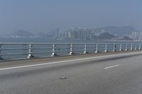 Concrete Bridge Overlooking the Coastal Waters of Hong Kong on a Clear Sky Day