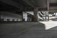 an empty train station with a lot of concrete floors and flooring areas in the background