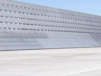 the building has vertical concrete walls and concrete floors to separate it from a long wall