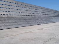 the building has vertical concrete walls and concrete floors to separate it from a long wall