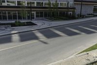 this is an image of a residential area with stop lights, trees, and concrete buildings