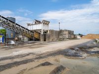 a view of the concrete factory from the road side with its equipment on display and next to the truck