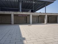 a parking garage with empty open spaces and no one in sight to enter it to