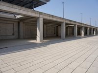 a parking garage with empty open spaces and no one in sight to enter it to