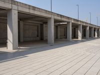 a parking garage with empty open spaces and no one in sight to enter it to