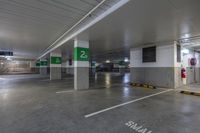 a concrete parking garage filled with lots of space for cars to park and take advantage