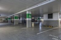 a concrete parking garage filled with lots of space for cars to park and take advantage