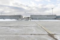 Concrete Parking Lot and Asphalt Road