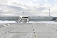 Concrete Parking Lot and Asphalt Road