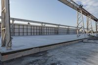 a large concrete platform under construction with sky background in a large area, outdoors,