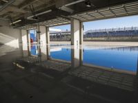 Concrete Road with Building and Water Reflection