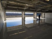 Concrete Road with Building and Water Reflection