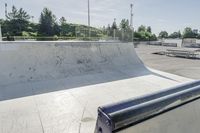 a concrete park with skateboards and benches is shown in this image, but at one time it was empty