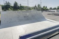 a concrete park with skateboards and benches is shown in this image, but at one time it was empty