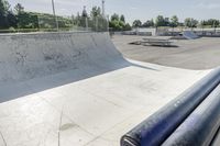 a concrete park with skateboards and benches is shown in this image, but at one time it was empty