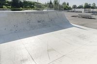 a concrete park with skateboards and benches is shown in this image, but at one time it was empty