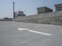 a parking lot and wall are pictured in a photo from the perspective point of view