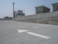 a parking lot and wall are pictured in a photo from the perspective point of view