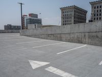 a parking lot and wall are pictured in a photo from the perspective point of view