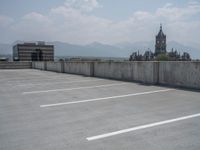 a parking lot and wall are pictured in a photo from the perspective point of view