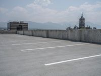 a parking lot and wall are pictured in a photo from the perspective point of view