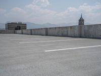 a parking lot and wall are pictured in a photo from the perspective point of view