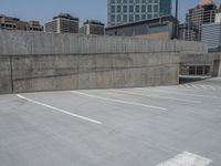 a parking lot and wall are pictured in a photo from the perspective point of view