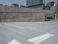 a parking lot and wall are pictured in a photo from the perspective point of view