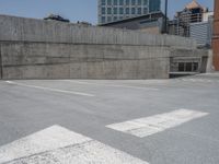 a parking lot and wall are pictured in a photo from the perspective point of view