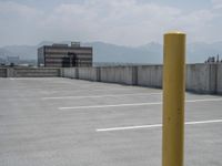 a parking lot and wall are pictured in a photo from the perspective point of view