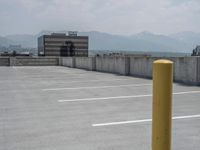 a parking lot and wall are pictured in a photo from the perspective point of view