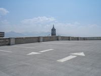 a parking lot and wall are pictured in a photo from the perspective point of view