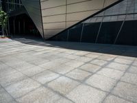 a close up image of a concrete wall outside a building and trees near by and on side