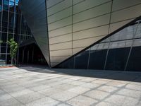 a close up image of a concrete wall outside a building and trees near by and on side