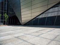 a close up image of a concrete wall outside a building and trees near by and on side