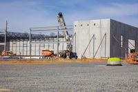 construction on a new building at a site near the water and sky in a city