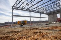 an under construction view of an industrial building on a construction site in the middle of winter